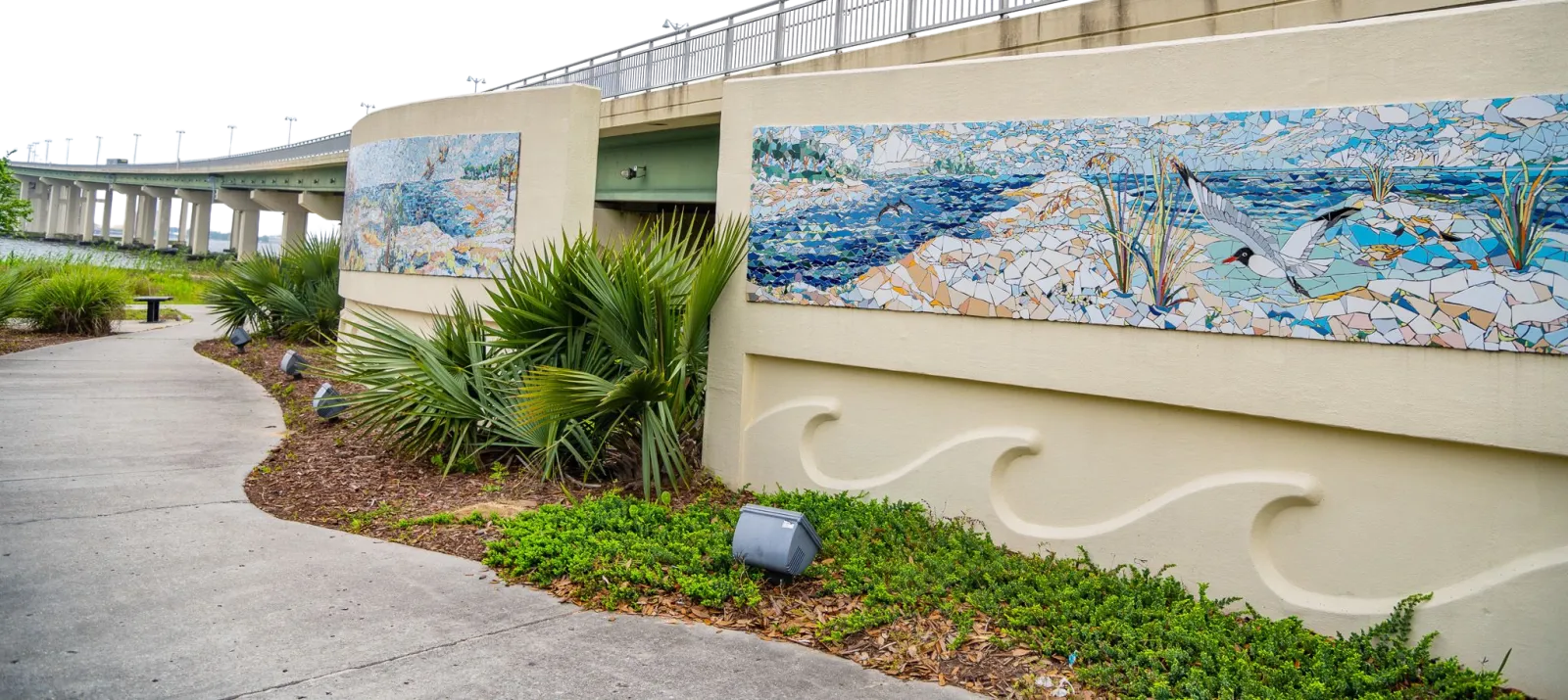 The Front Beach mosaic mural and carved wave seawall in Ocean Springs